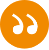 White quotation mark in an orange circle.